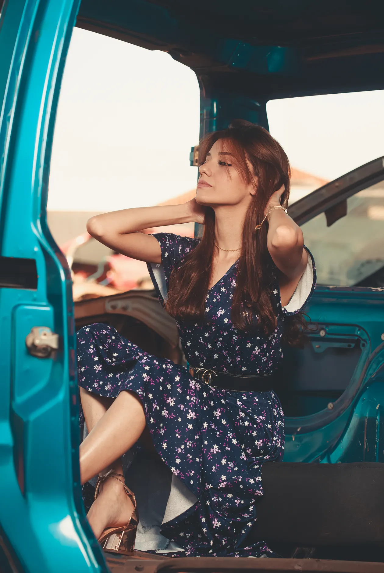 Woman in a floral belted dress